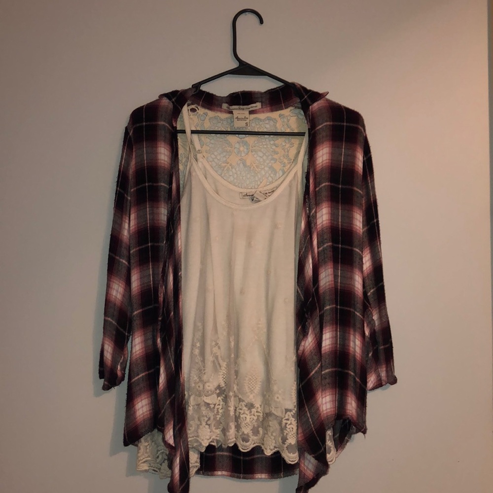 White tank top with plaid patterned cardigan.